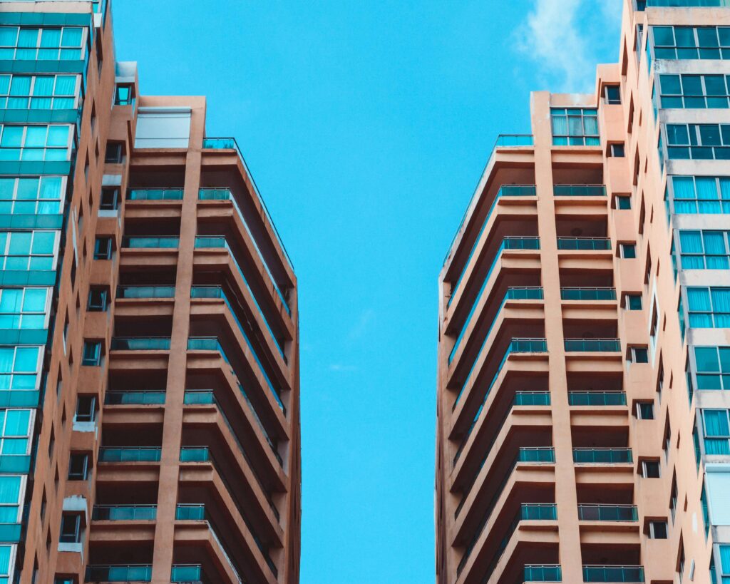 pexels-photo-783745-783745 Contemporary high-rise buildings contrasted against a vivid blue sky, showcasing modern urban architecture.
